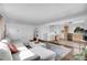 View of an open layout, with a living room leading into a charming kitchen and dining area at 215 Jay St, Lakewood, CO 80226