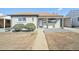 Charming home featuring a cozy covered porch, neat landscaping, and painted brick at 3340 Leyden St, Denver, CO 80207