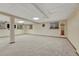 Finished basement with neutral carpet, recessed lighting, and a dart board at 17390 E Greenwood Cir, Aurora, CO 80013