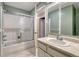 Bathroom with a shower, vanity, and mirror at 17390 E Greenwood Cir, Aurora, CO 80013