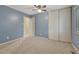 Bedroom featuring a closet and light blue walls at 17390 E Greenwood Cir, Aurora, CO 80013