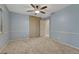 Bedroom featuring a closet and light blue walls at 17390 E Greenwood Cir, Aurora, CO 80013