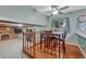 Bright dining area with hardwood floors and direct access to the kitchen and living area at 17390 E Greenwood Cir, Aurora, CO 80013