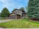 Charming two-story home with a well-maintained front yard and attached two-car garage at 17390 E Greenwood Cir, Aurora, CO 80013