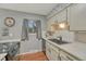 Charming kitchen with tiled backsplash, updated countertops and windows allowing natural light at 17390 E Greenwood Cir, Aurora, CO 80013