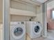Convenient laundry area with modern washer and dryer, as well as overhead storage at 17390 E Greenwood Cir, Aurora, CO 80013