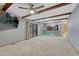Open living room with carpeted floors, exposed beams, and an open view of the kitchen area at 17390 E Greenwood Cir, Aurora, CO 80013