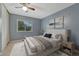 Comfortable main bedroom showcases a large window, neutral decor, and bedside tables at 17390 E Greenwood Cir, Aurora, CO 80013