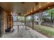 Cozy covered patio with string lights and ceiling fan overlooking the yard at 17390 E Greenwood Cir, Aurora, CO 80013