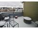Balcony with snow covered furniture and townhouse view at 3401 N Xenia St, Denver, CO 80238
