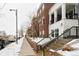Townhouses in winter with snow and covered porches at 3401 N Xenia St, Denver, CO 80238