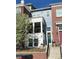 Charming townhome boasts a welcoming porch, well-maintained landscaping, and appealing curb appeal during spring at 3401 N Xenia St, Denver, CO 80238