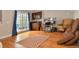 Bright living room with hardwood floors, desk, wet bar, and sliding glass doors at 3401 N Xenia St, Denver, CO 80238