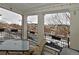 Relaxing covered porch area offering views of the neighborhood with outdoor seating at 3401 N Xenia St, Denver, CO 80238