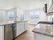 Spacious kitchen featuring stainless steel appliances and granite countertops, plus a slider to the backyard at 17969 Dandy Brush Ln, Parker, CO 80134