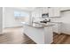Bright kitchen with granite countertops, modern appliances, and a large window at 17969 Dandy Brush Ln, Parker, CO 80134