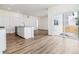 Open concept kitchen featuring granite countertops, stainless steel appliances, and sliding glass doors to the backyard at 17969 Dandy Brush Ln, Parker, CO 80134