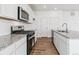 Contemporary kitchen featuring granite countertops, stainless steel appliances and a large island at 17969 Dandy Brush Ln, Parker, CO 80134