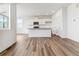 Inviting open-concept living space with modern flooring connected to the bright kitchen at 17969 Dandy Brush Ln, Parker, CO 80134