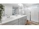 Large bathroom featuring double sinks, ample lighting, and a glass-enclosed shower at 27857 E 8Th Ave, Aurora, CO 80018