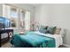 Cozy bedroom with a large window and neutral decor creating a serene atmosphere at 27857 E 8Th Ave, Aurora, CO 80018
