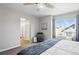 Bright bedroom with ensuite bathroom and window view at 27857 E 8Th Ave, Aurora, CO 80018