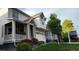 Two-story home with a two-car garage, a covered front porch, and well-kept landscaping at 27857 E 8Th Ave, Aurora, CO 80018