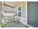 Inviting covered front porch with seating area, perfect for relaxing and enjoying the outdoors at 27857 E 8Th Ave, Aurora, CO 80018