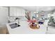 Modern kitchen island with white countertops, stylish cabinetry, and open layout at 27857 E 8Th Ave, Aurora, CO 80018