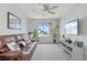 Inviting living room with plush seating, ceiling fan and large window at 27857 E 8Th Ave, Aurora, CO 80018