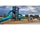 Community playground with colorful equipment, a slide, and a swing set for enjoyment at 27857 E 8Th Ave, Aurora, CO 80018