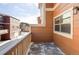 Exterior shot showcasing a balcony with weathered wood and views of neighboring townhomes at 18189 E Saskatoon Pl, Parker, CO 80134