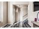 Bright foyer with high ceilings, hardwood floors, an elegant staircase, and abundant natural light at 18189 E Saskatoon Pl, Parker, CO 80134