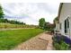 Landscaped backyard with a patio, seating, and lush green lawn, great for outdoor enjoyment at 22026 Hill Gail Way, Parker, CO 80138
