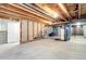 Unfinished basement showcasing open ceiling, concrete floors, and roughed-in plumbing at 22026 Hill Gail Way, Parker, CO 80138