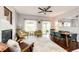 Bright and airy living room featuring hardwood floors and plenty of natural light at 22026 Hill Gail Way, Parker, CO 80138