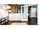 Bright living room featuring hardwood floors, modern lighting, and stylish barn door at 22026 Hill Gail Way, Parker, CO 80138