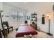 Bright bedroom with massage table and black chairs; a tranquil space for relaxation at 7885 Yampa River Ave, Littleton, CO 80125