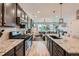 Spacious kitchen featuring stainless steel appliances, granite countertops, and an open-concept layout at 7885 Yampa River Ave, Littleton, CO 80125