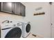 Functional laundry room equipped with modern Samsung washer and dryer units at 7885 Yampa River Ave, Littleton, CO 80125