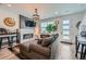 Comfortable living room featuring a stone fireplace, stylish decor, and a cozy seating area at 7885 Yampa River Ave, Littleton, CO 80125