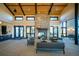 Inviting community lounge featuring a stone fireplace, comfortable seating, and abundant natural light at 7885 Yampa River Ave, Littleton, CO 80125