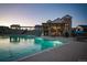 Beautiful community pool with lounge chairs and clubhouse, perfect for relaxation and recreation at 7885 Yampa River Ave, Littleton, CO 80125