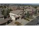 An elevated perspective displays this home nestled in a neighborhood with tree coverage and varied rooflines at 9617 Silent Hills Ln, Lone Tree, CO 80124