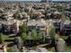 Overhead shot revealing the house surrounded by other homes and a lush green canopy at 9617 Silent Hills Ln, Lone Tree, CO 80124