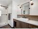 Elegant bathroom with a modern vanity, sleek fixtures, and walk-in shower at 1291 S Gaylord St, Denver, CO 80210