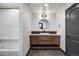 Stylish bathroom featuring a vanity with modern fixtures and a shower/tub combo at 1291 S Gaylord St, Denver, CO 80210