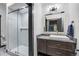 Bright bathroom featuring a glass enclosed shower and modern vanity with stylish fixtures at 1291 S Gaylord St, Denver, CO 80210