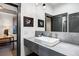 Modern bathroom featuring a stylish vessel sink, stone countertop, and sleek fixtures at 1291 S Gaylord St, Denver, CO 80210