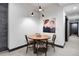 Dining room features wooden table with 4 chairs and overhead lighting, ideal for Gathering meals at 1291 S Gaylord St, Denver, CO 80210